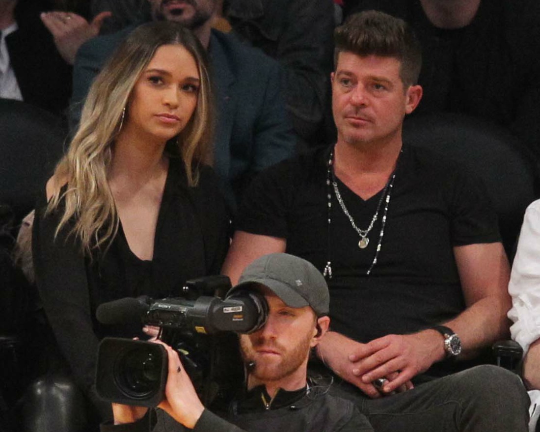 Robin Thicke and April Love Geary out at the Los Angeles Lakers game
