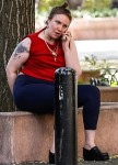 Lena Dunham spotted talking on the phone sitting on a park next to her hotel