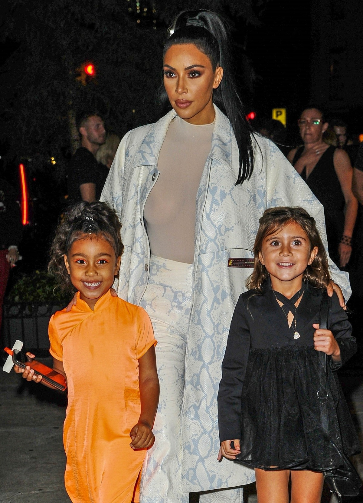 Kim Kardashian and North have a big smile as they leave Cipriani Downtown