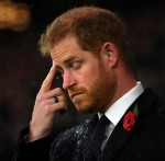 Britain's Prince Harry stands during a wreath-laying ceremony to commemorate 100 years since the end of the First World War, before the England v New Zealand rugby match at Twickenham Stadium, in London