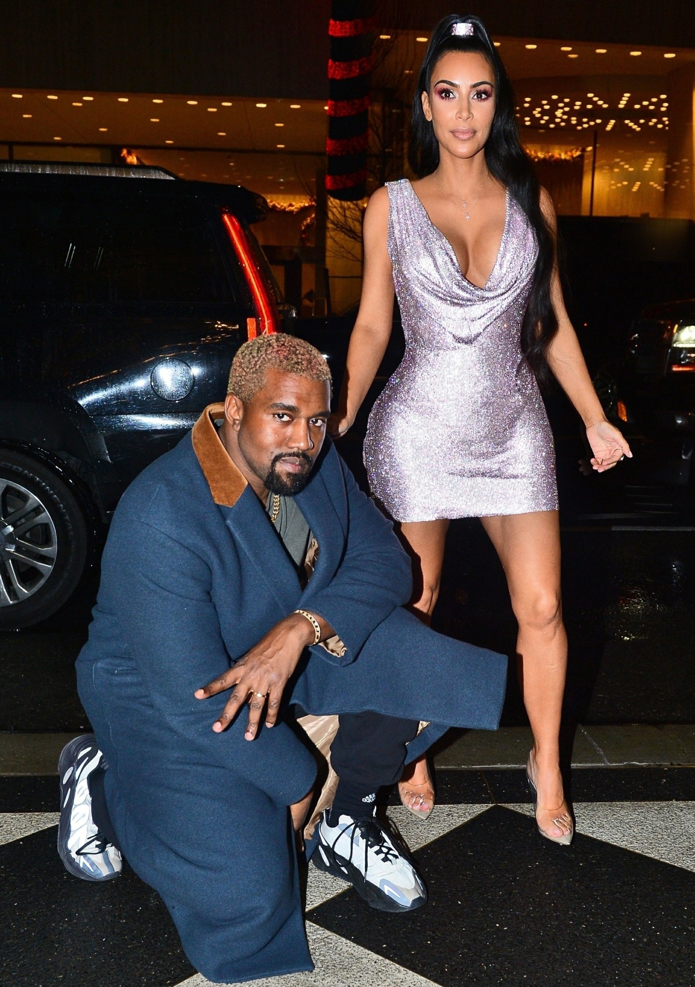 Kim Kardashian and Kanye West strike a pose in front of their NYC hotel