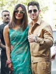 Priyanka Chopra and Nick Jonas are all smiles posing for pictures as newlyweds in Jodhpur, India