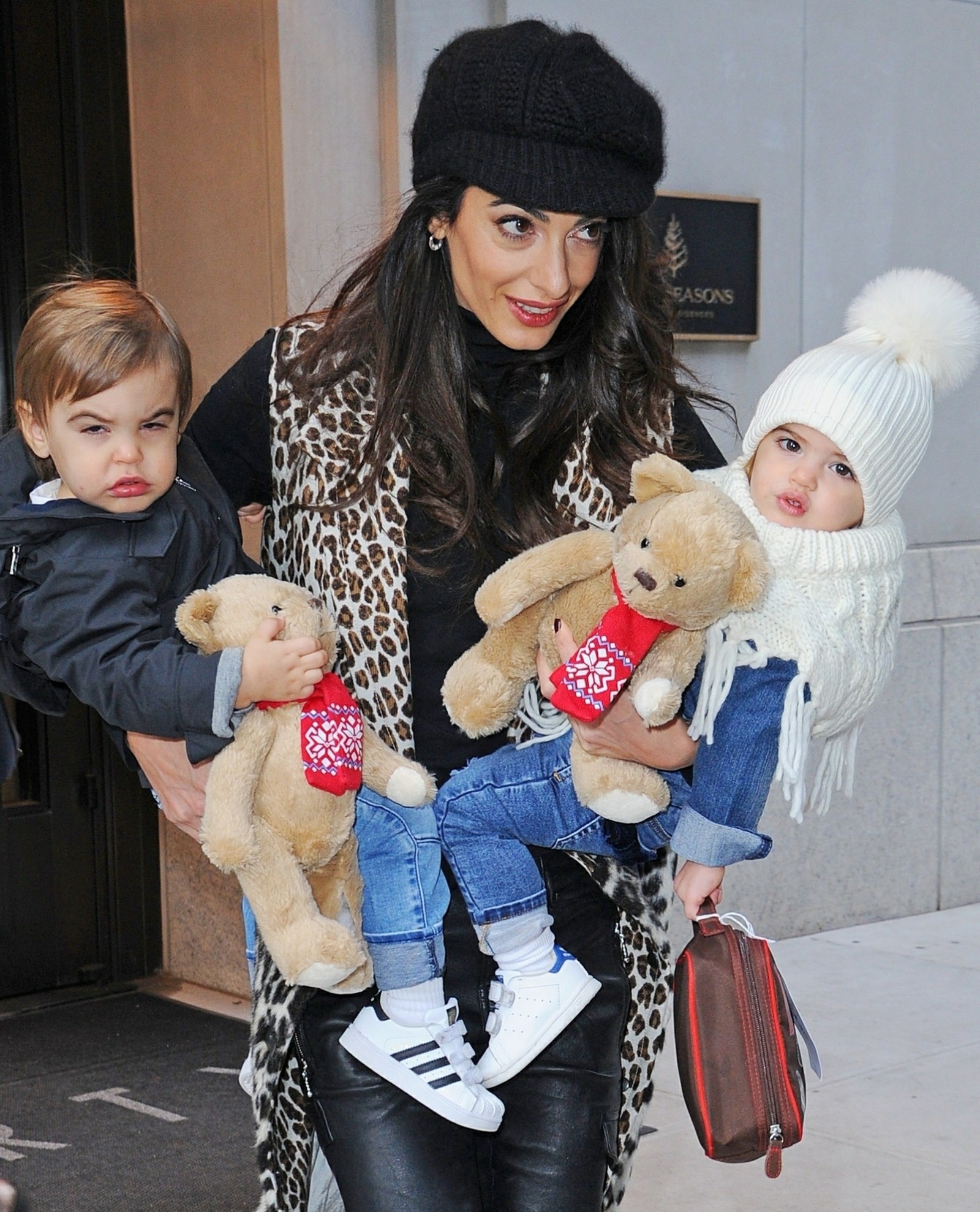 Amal Clooney is all smiles as she steps out with her children  Alexander and Ella