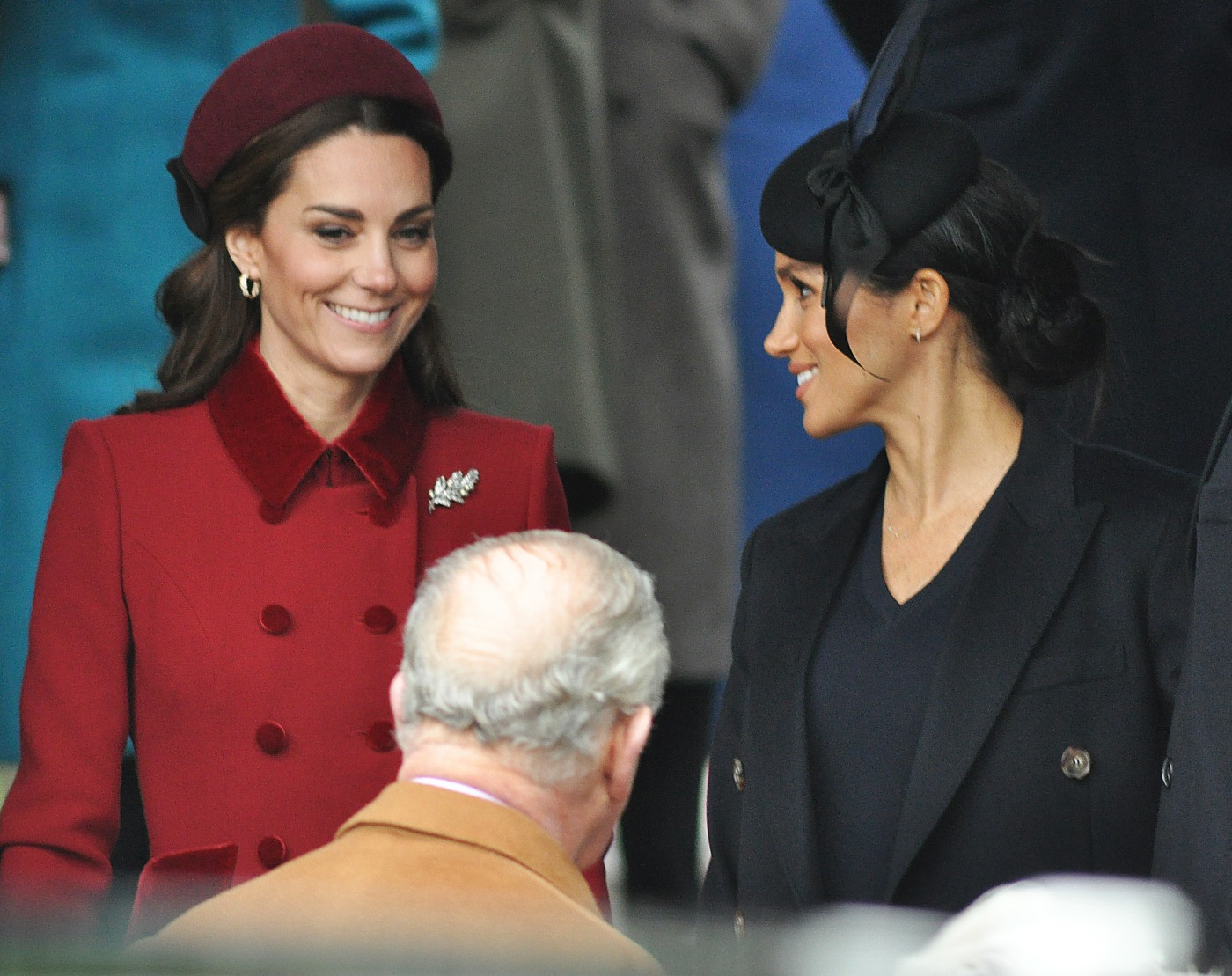 Duchesses Cambridge (left) and Sussex laughing together after the Xmas Day service at Sandringham Church, 25th December, 2018.