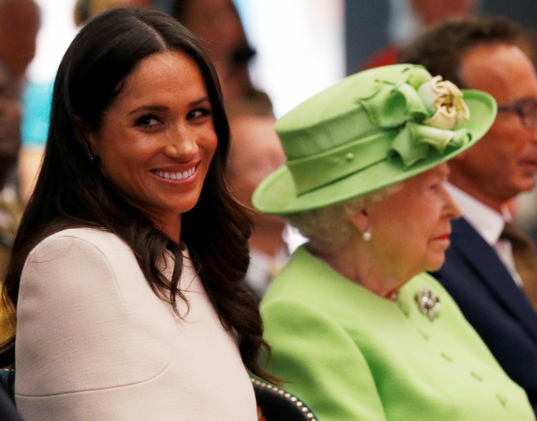 Britain's Queen Elizabeth and Meghan, the Duchess of Sussex, visit the Storyhouse in Chester