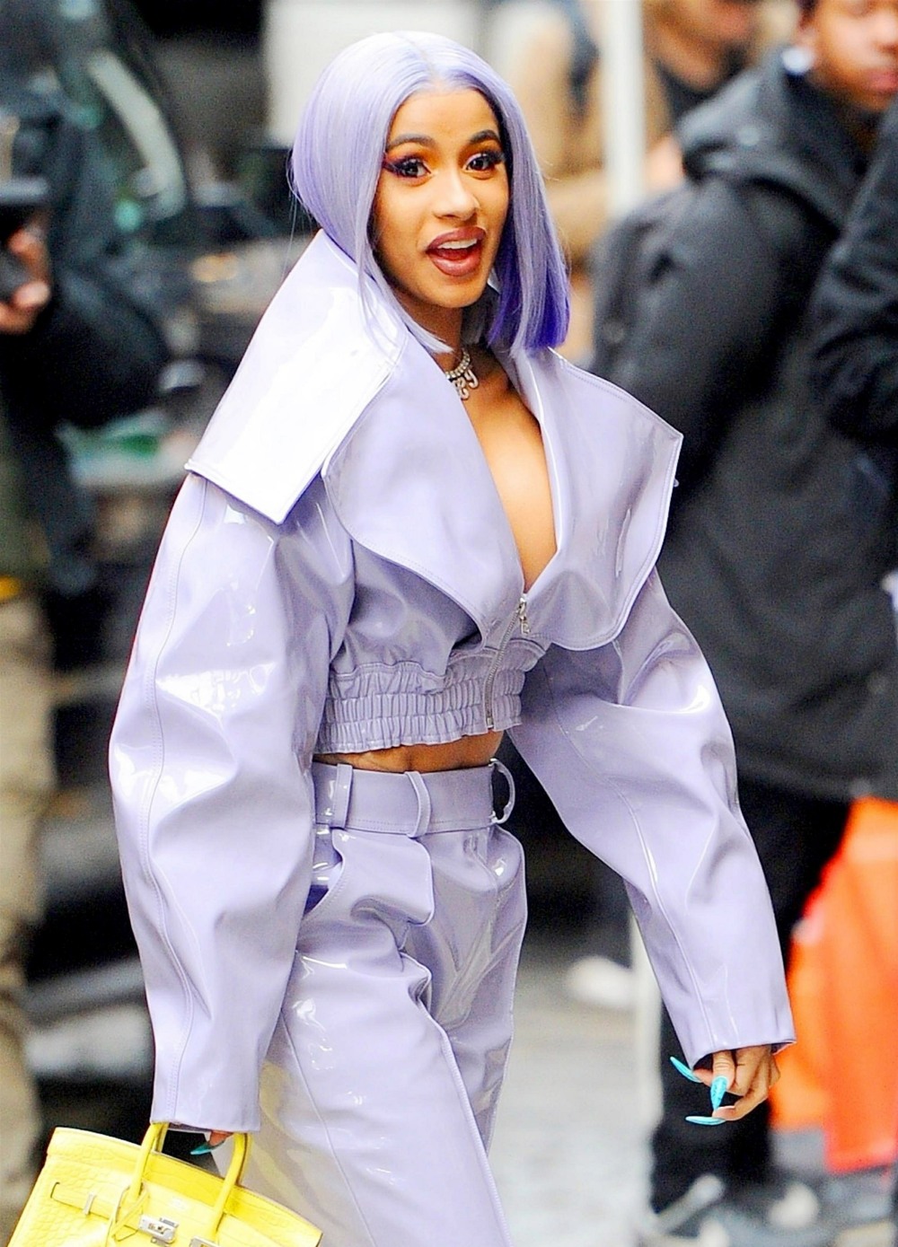 Cardi B heads out to run errands in a wild purple outfit