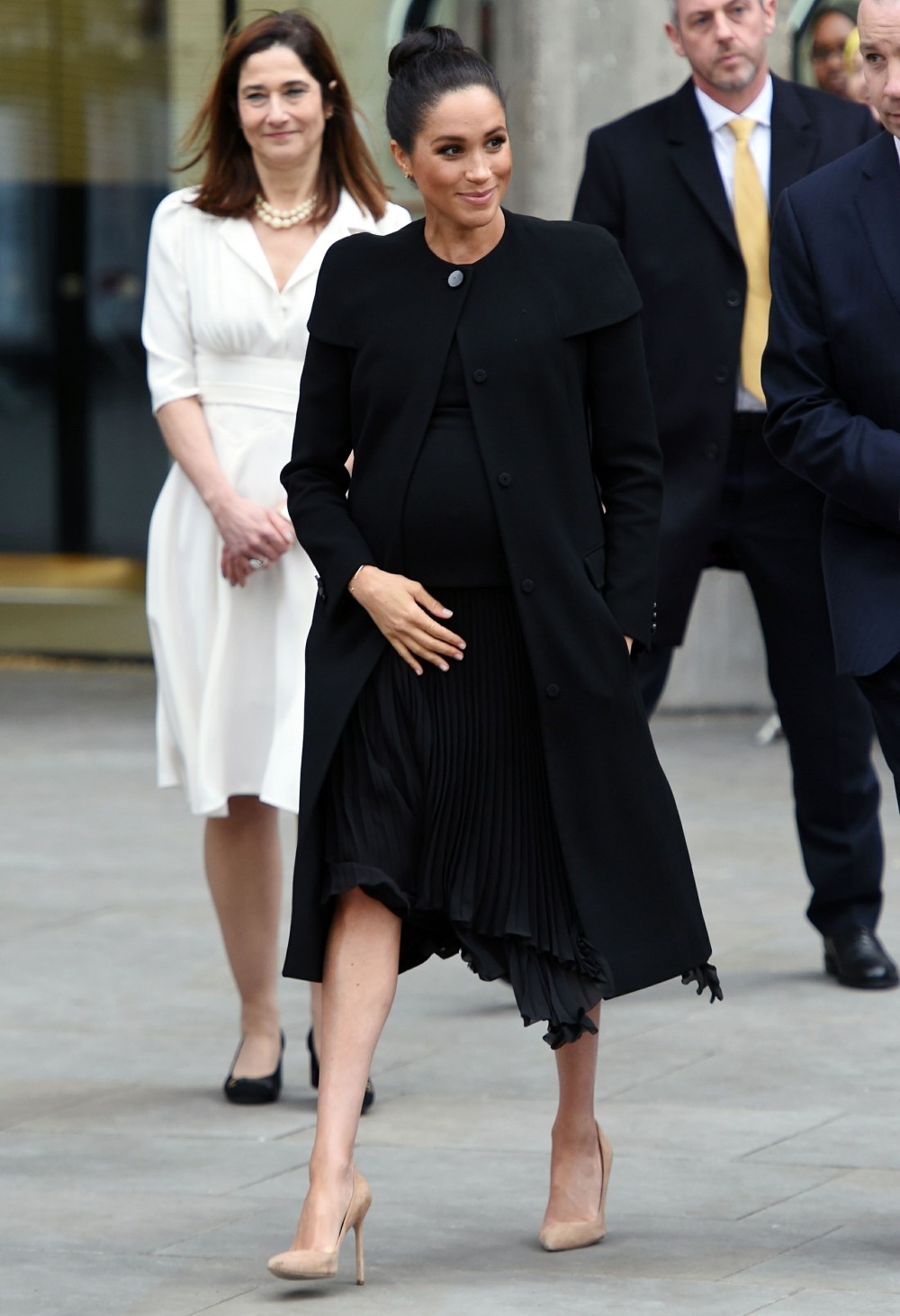 Pregnant Meghan Markle greets members of the public while leaving the Association of Commonwealth Universities in London