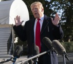 Trump speaks to the media as he departs for Camp David.