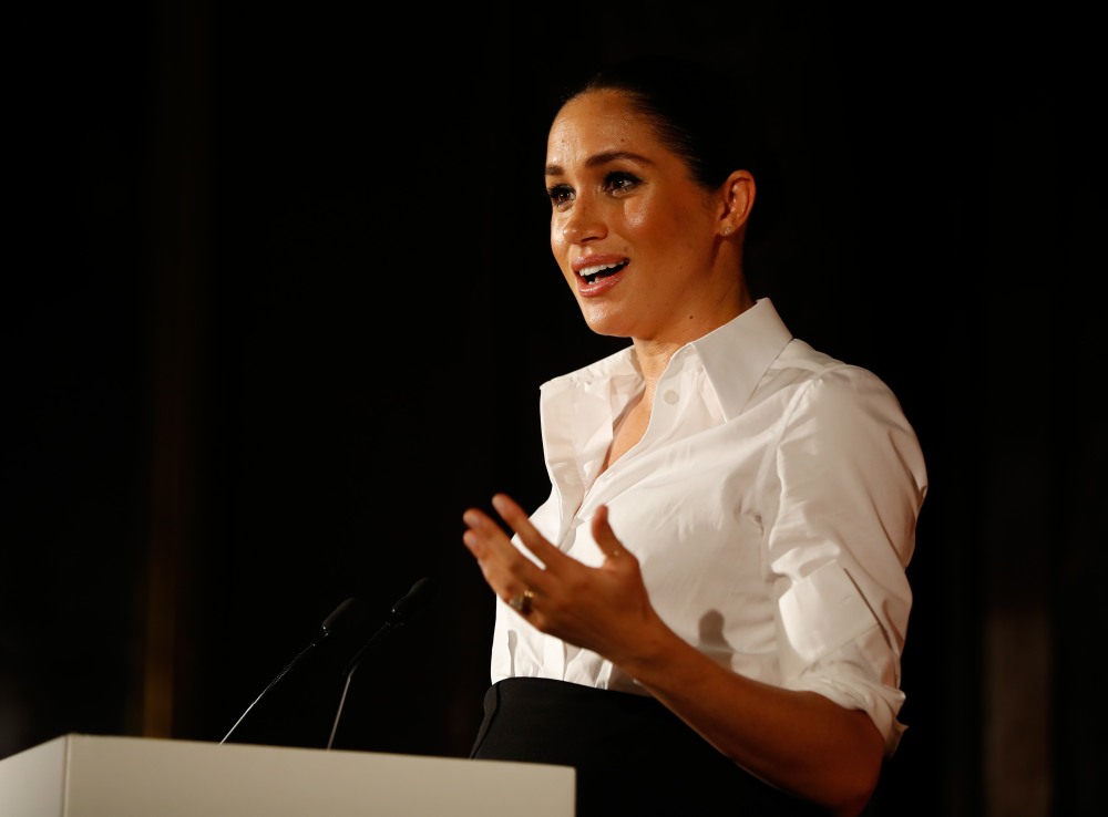 Britain's Meghan, Duchess of Sussex presents the Celebrating Excellence Award to Nathan Forster, a former soldier of the Army's Parachute Regiment, at the annual Endeavour Fund Awards at Drapers Hall in London on February 7, 2019. - The Royal Foundation's Endeavour Fund Awards celebrate the achievements of wounded, injured and sick servicemen and women who have taken part in sporting and adventure challenges over the last year. Forster suffered serious injuries whilst serving with the Parachute Regiment in Afghanistan. With Flying for Freedom Nathan discovered a passion and aptitude for flying and in only five years, he has gone from having no experience of flying, to flying 737s for Thomas Cook.