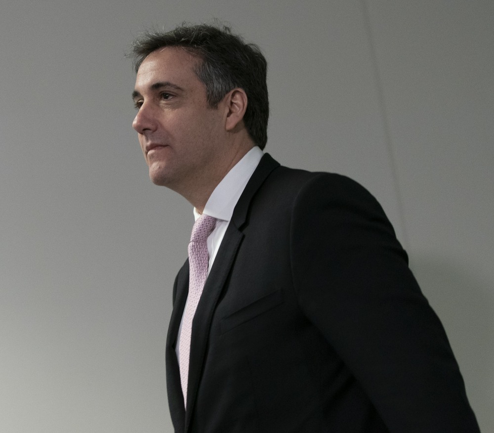 Former Trump attorney Michael Cohen arrives for his appearance before the Senate Intelligence Committee