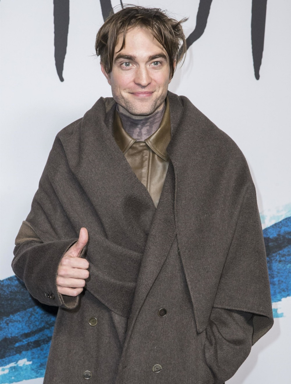 Guests pose as they arrive to the Dior Mens fashion show during Paris Fashion Week