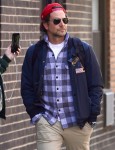 Bradley Cooper appears very serious getting a coffee in the West Village