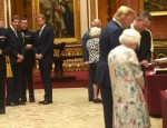 Prince Harry views displays of US items from the Royal Collection at Buckingham Palace in London.