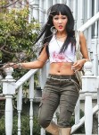 A bloody Constance Wu flaunts her abs on set!