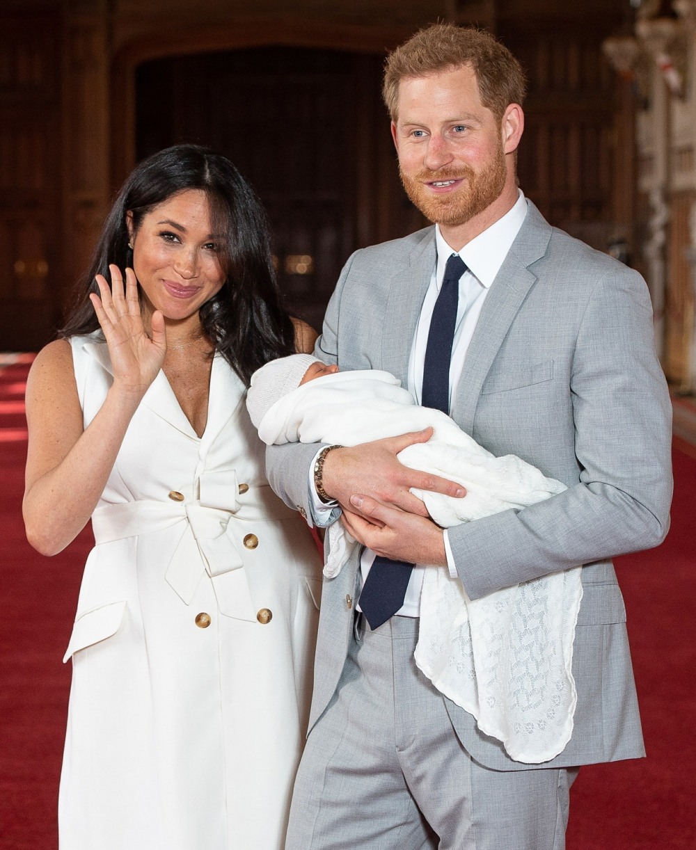 Prince Harry, Duke of Sussex and Meghan, Duchess of Sussex, pose with their newborn son
