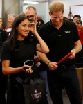 Prince Harry and Meghan Markle watch the Red Sox vs Yankees game