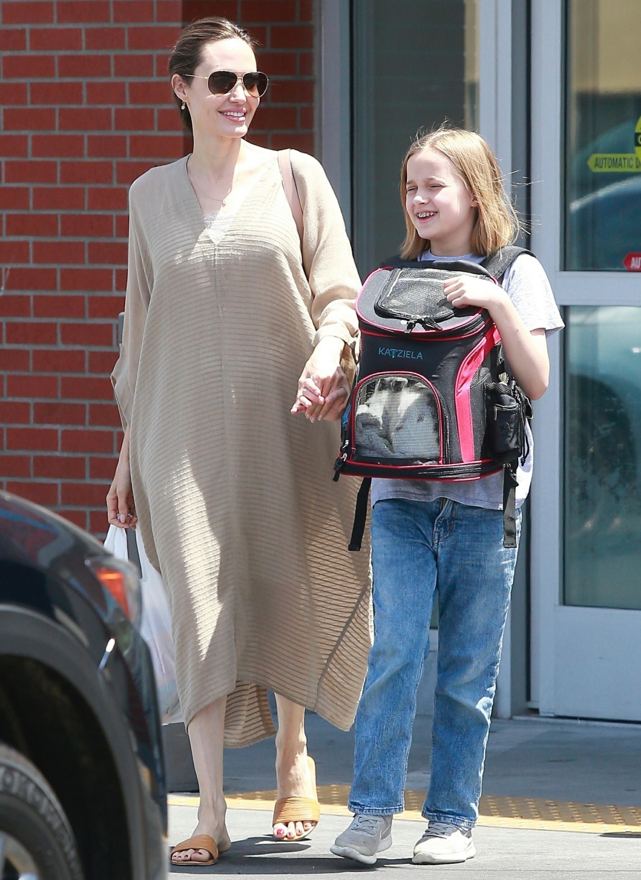 Angelina Jolie leaves Petco with her happy daughter an a pet