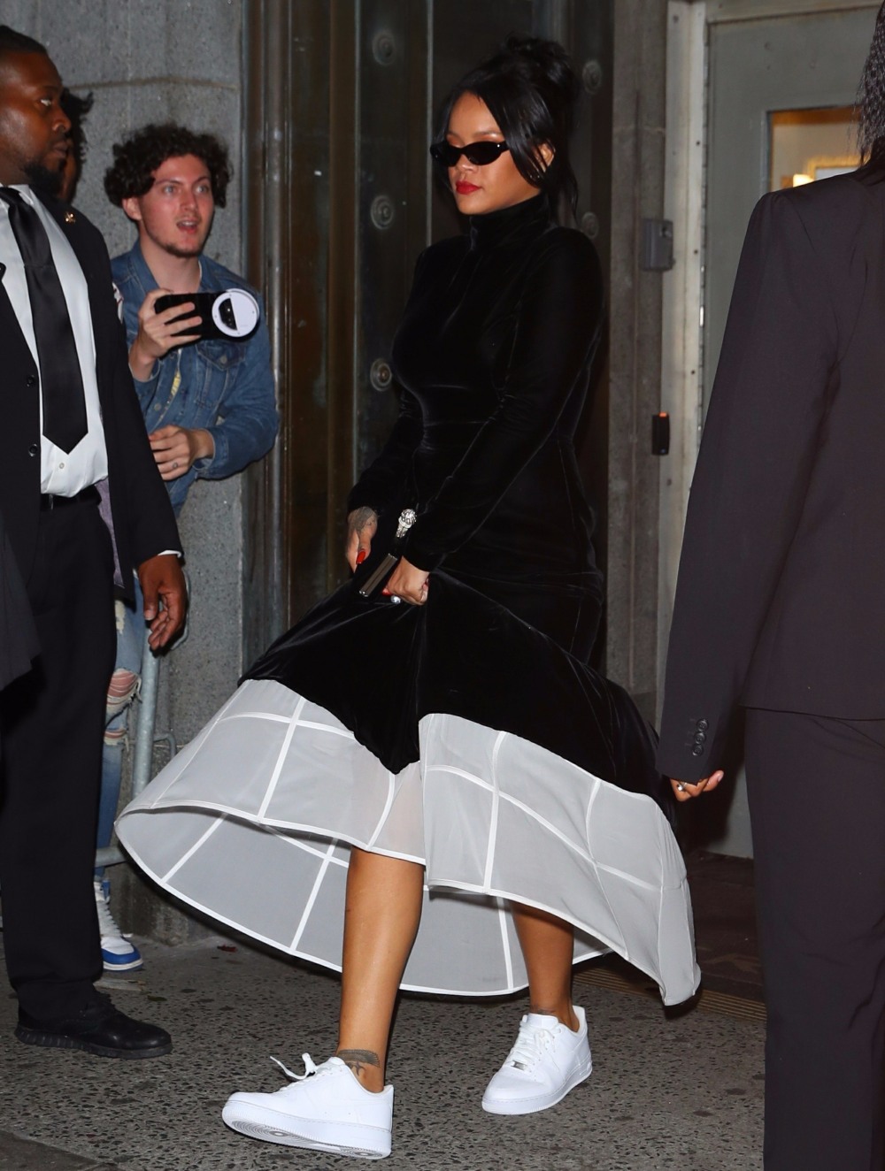 Rihanna stuns in Nike Air Force sneakers and an elegant gown as she leaves her annual Diamond Ball in NYC!