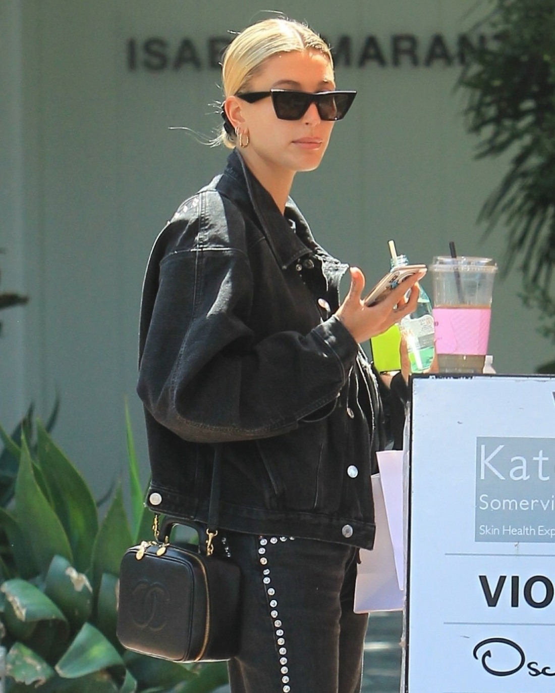 Hailey Baldwin: sleek in all-black outfit during an outing on Melrose Place