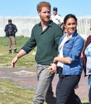 Prince Harry, Duke of Sussex and Meghan, Duchess of Sussex with surf mentors