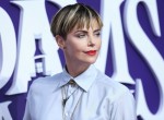 Actress Charlize Theron wearing Dior arrives at the World Premiere Of MGM's 'The Addams Family' held at the Westfield Century City AMC on October 6, 2019 in Century City, Los Angeles, California, United States.