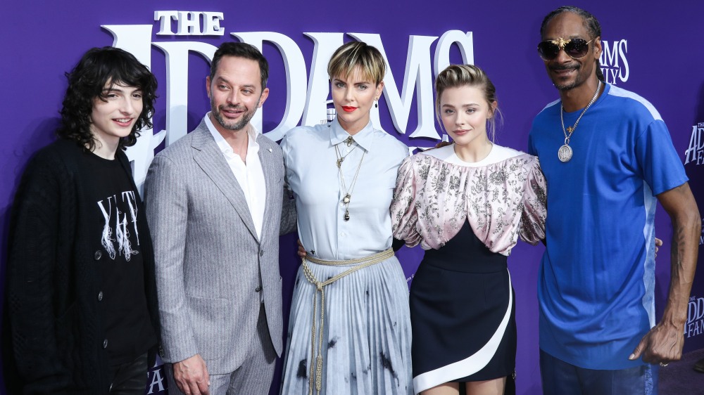 Finn Wolfhard, Nick Kroll, Charlize Theron, Chloe Grace Moretz and Snoop Dogg arrive at the World Premiere Of MGM's 'The Addams Family' held at the Westfield Century City AMC on October 6, 2019 in Century City, Los Angeles, California, United States.