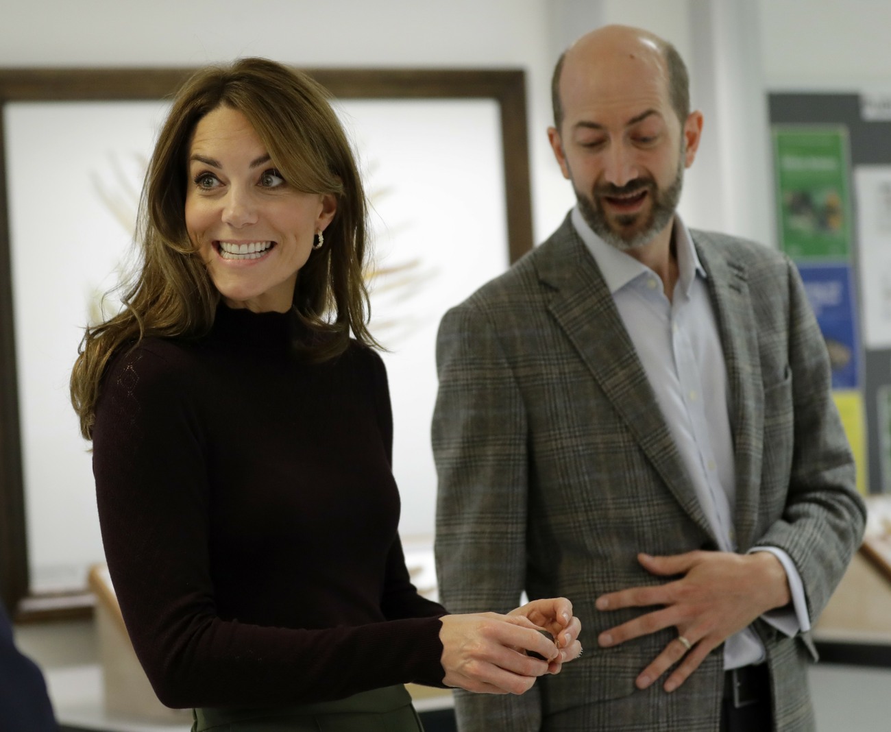 Britain's Kate, The Duchess of Cambridge stands alongside Dr John Tweddle as she hold a piece of meteorite at The Natural History Museum in London, Wednesday, Oct. 9, 2019. The Duchess of Cambridge, Patron of the Museum, visited the Natural History Museum'
