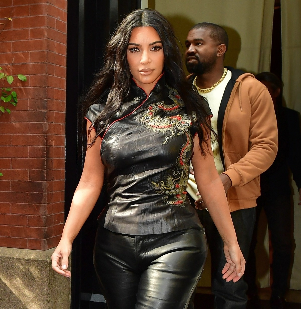 Kim Kardashian steps out of her hotel in Asian inspired top in NY