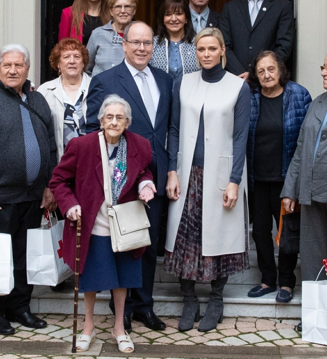 Prince Albert II and Princess Charlene of Monaco present gifts to the disadvantaged at the Monegasque Red Cross office