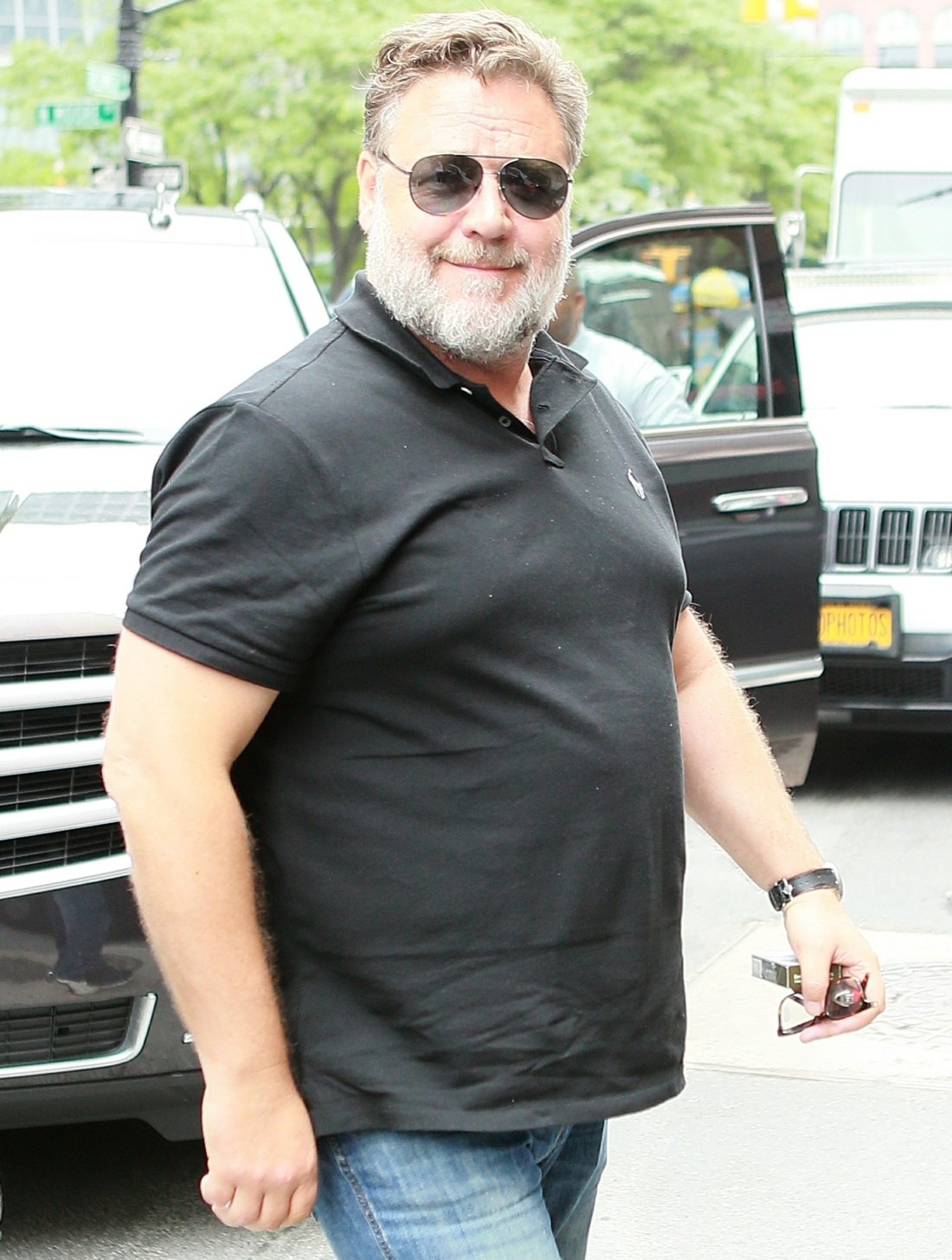 Russell Crowe cuts a casual figure as he returns to his Tribeca hotel with a smile