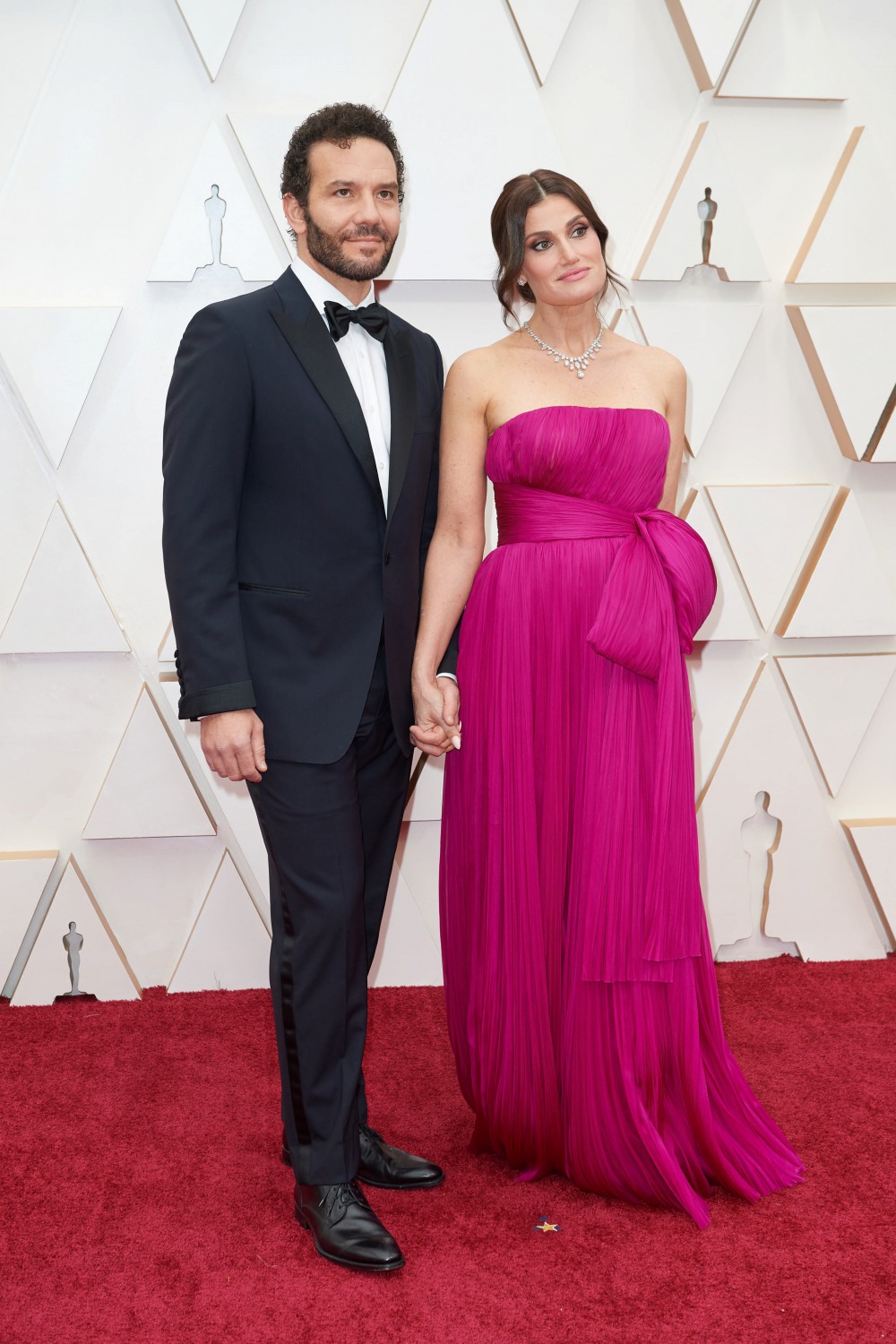 Aaron Lohr and Idina Menzel arrive on the red carpet of The 92nd Oscars¬Æ at the Dolby¬Æ Theatre...