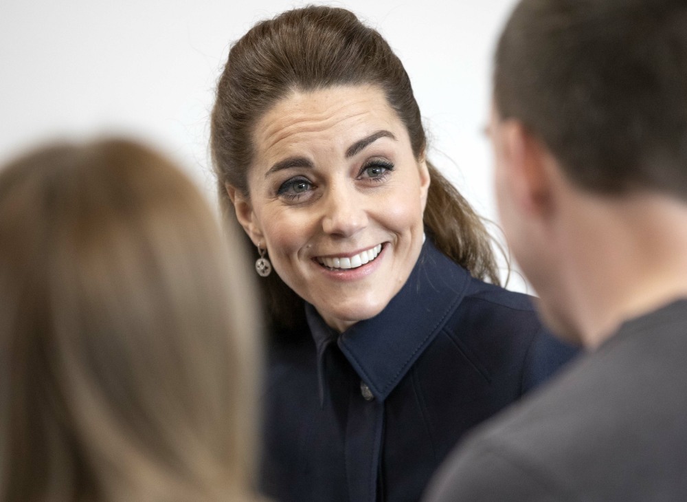 The Duchess of Cambridge talks to staff and patients during a visit to the defence medical rehabilit...