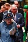 Britain's Queen Elizabeth II (C), followed by Britain's Prince Edward, Earl of Wessex (L), Britain's Prince Harry, Duke of Sussex (2L), Britain's Prince Charles, Prince of Wales (centre R), Britain's Prince William, Duke of Cambridge, (2R) and Meghan, Duch