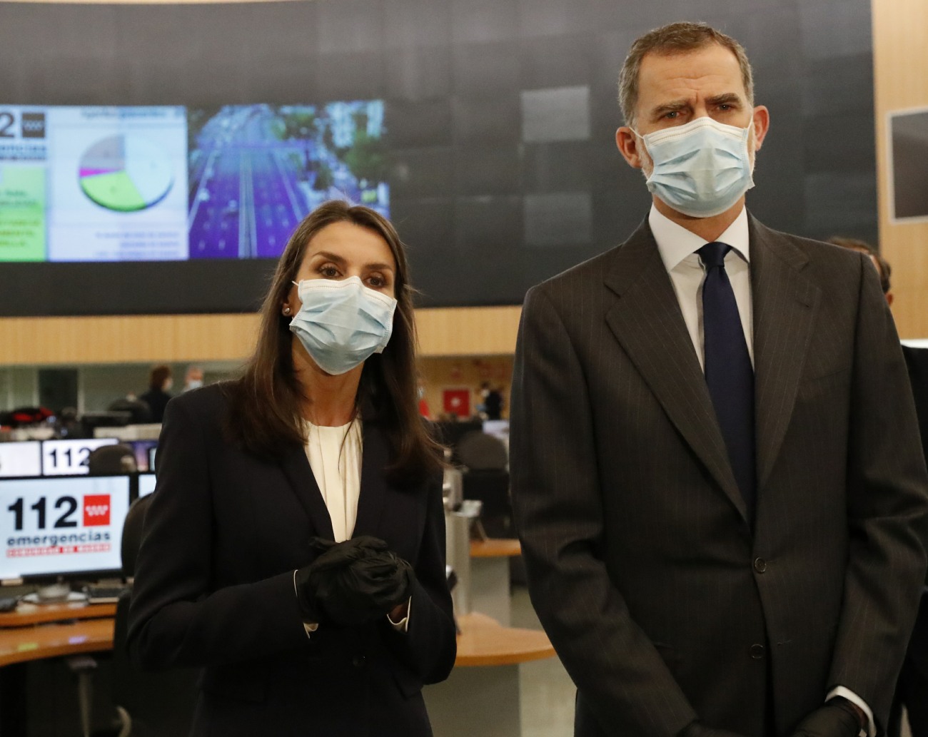 King Felipe VI of Spain and Queen Letizia of Spain return to public duties and wearing PPE as they visit facilities in Madrid, Spain