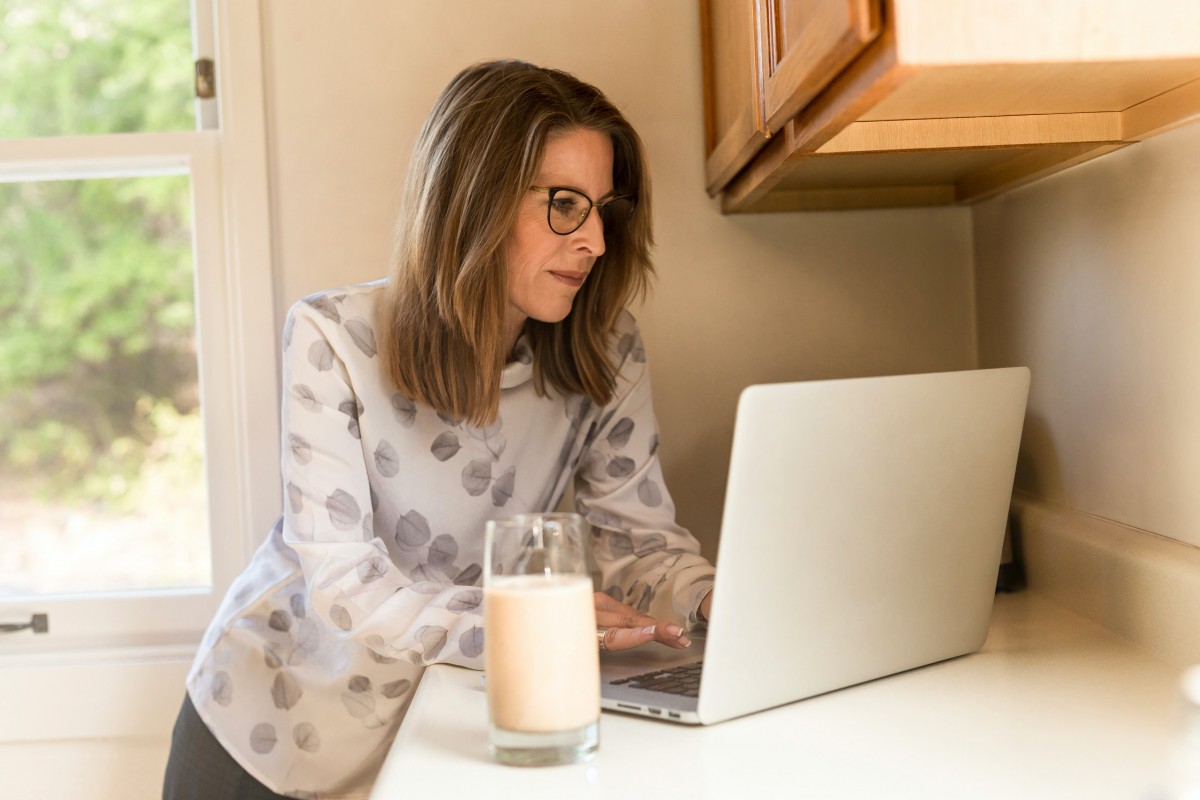 woman-using-gray-laptop-computer-in-kitchen-1251833