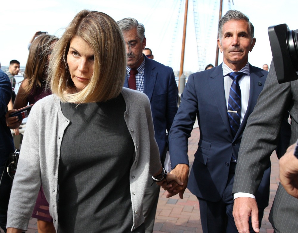 Lori Loughlin and husband Mossimo Giannulli exiting courthouse