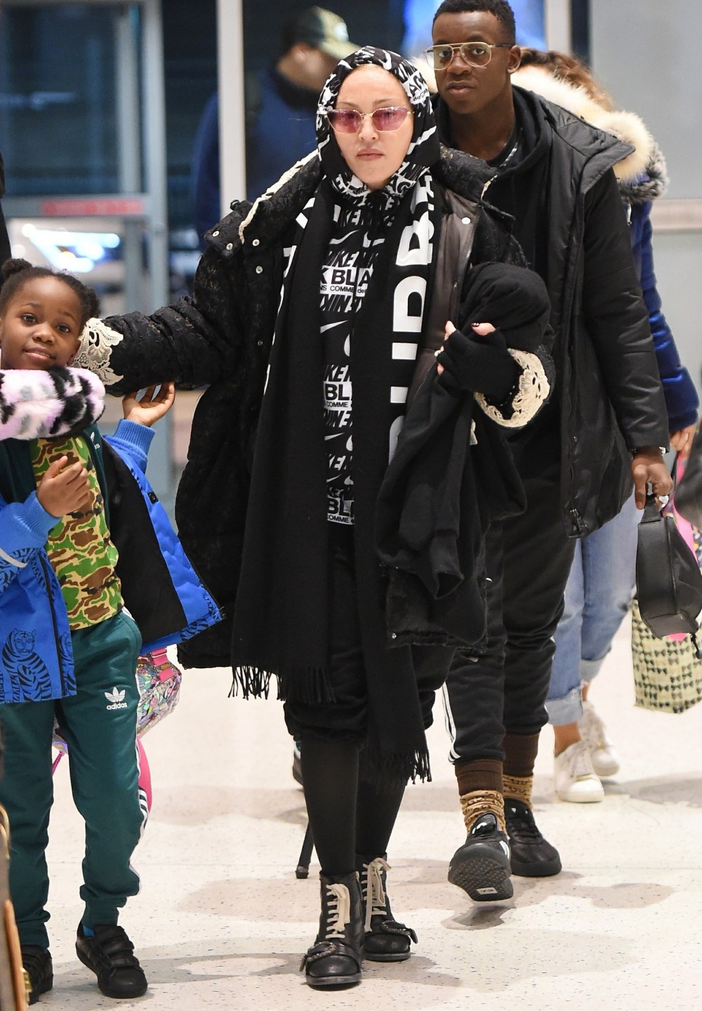 Madonna and boyfriend Ahlamalik Williams arrive at JFK Airport with the kids