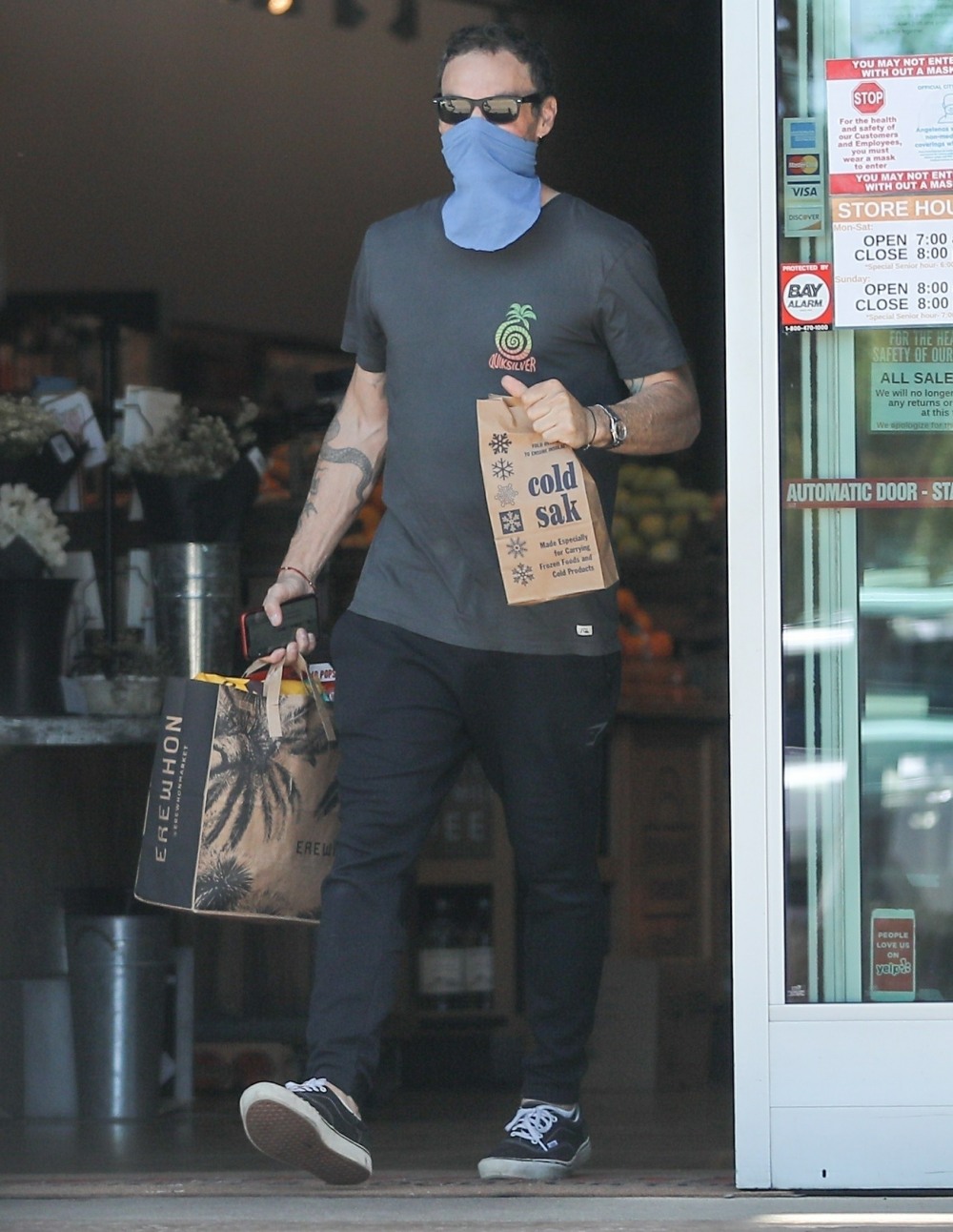 Brian Austin Green waits in line to go grocery shopping in Calabasas