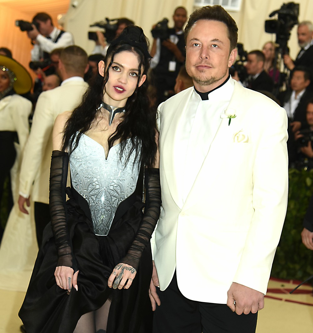 Grimes and Elon Musk at the Costume Institute Benefit at the Metropolitin Museum of Art at the opening of 'Heavenly Bodies: Fashion and the Catholic Imagination' in New York City