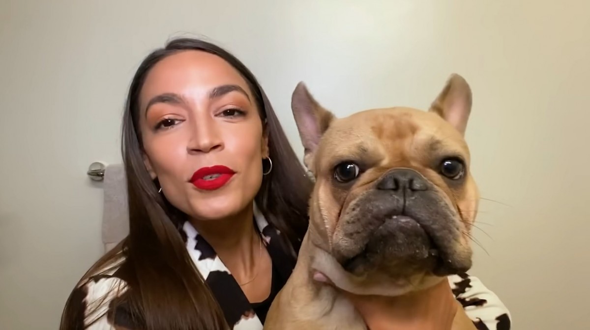 Alexandria Ocasio-Cortez  with her dog, Deco