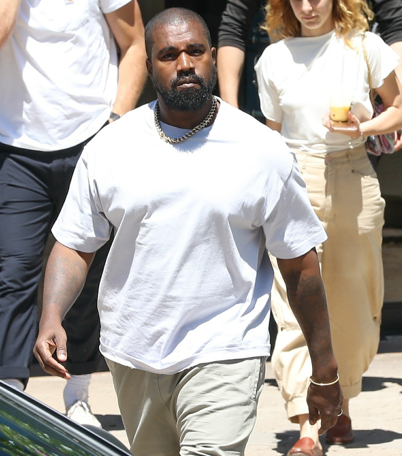 Kanye West exiting his office after a few morning meetings