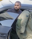 Kanye West makes a quick trip to his office