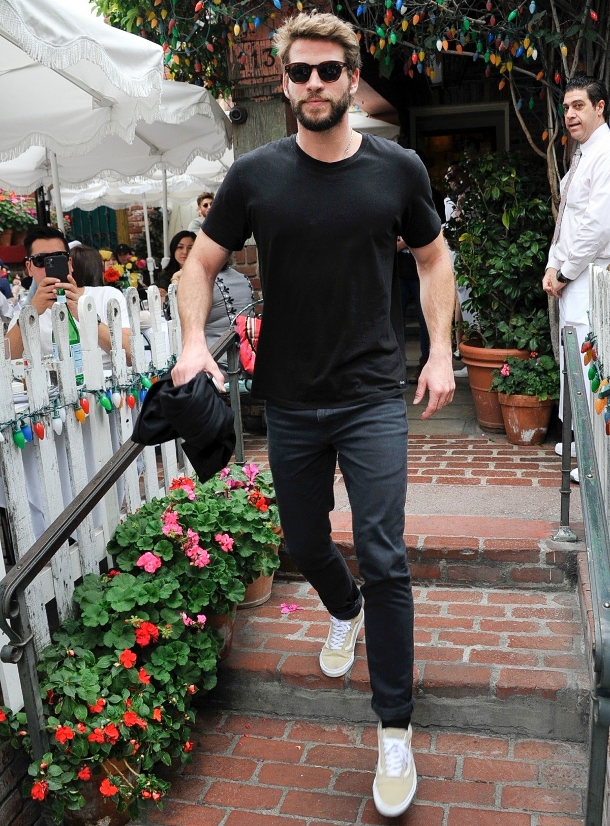 Liam Hemsworth and new girlfriend Gabriella Brooks leave The Ivy after lunch with friends