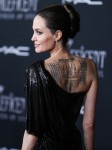 Actress Angelina Jolie wearing Atelier Versace with Cartier jewelry arrives at the World Premiere Of Disney's 'Maleficent: Mistress Of Evil' held at the El Capitan Theatre on September 30, 2019 in Hollywood, Los Angeles, California, United States.