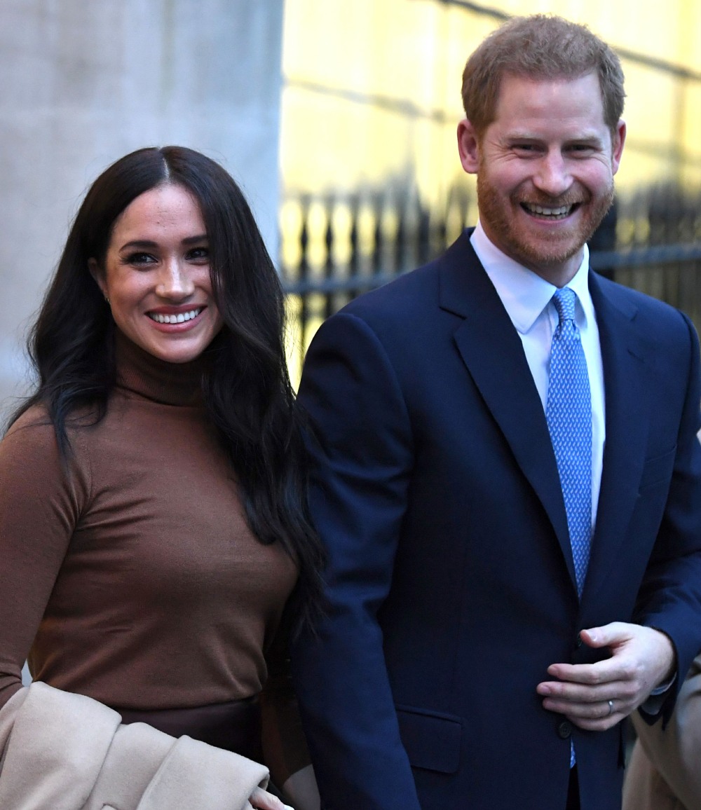 Britain's Prince Harry, Duke of Sussex and Meghan, Duchess of Sussex react as they leave after their visit to Canada House in thanks for the warm Canadian hospitality and support they received during their recent stay in Canada, in London on January 7, 202