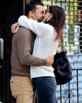 Katie Holmes and Emilio Vitolo are all smiles as they continue another steamy make-out session outside his restaurant in NYC