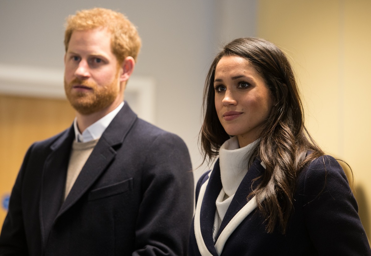 Britain's Prince Harry (L) and his fiancee US actress Meghan Markle (R) visit Nechells Wellbeing Centre to join Coach Core apprentices taking part in a training masterclass in Birmingham, central England on March 8, 2018.  Prince Harry and Meghan Markle visited Birmingham to learn more about the work of two projects which support young people from the local community. The Coach Core apprenticeship scheme was designed by The Royal Foundation of The Duke and Duchess of Cambridge and Prince Harry to train young people aged 16 - 24 with limited opportunities to become sports coaches and mentors within their communities.