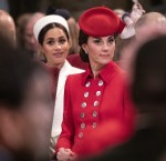 The Duchess of Cambridge sits near the Duchess of Sussex as they attend the West