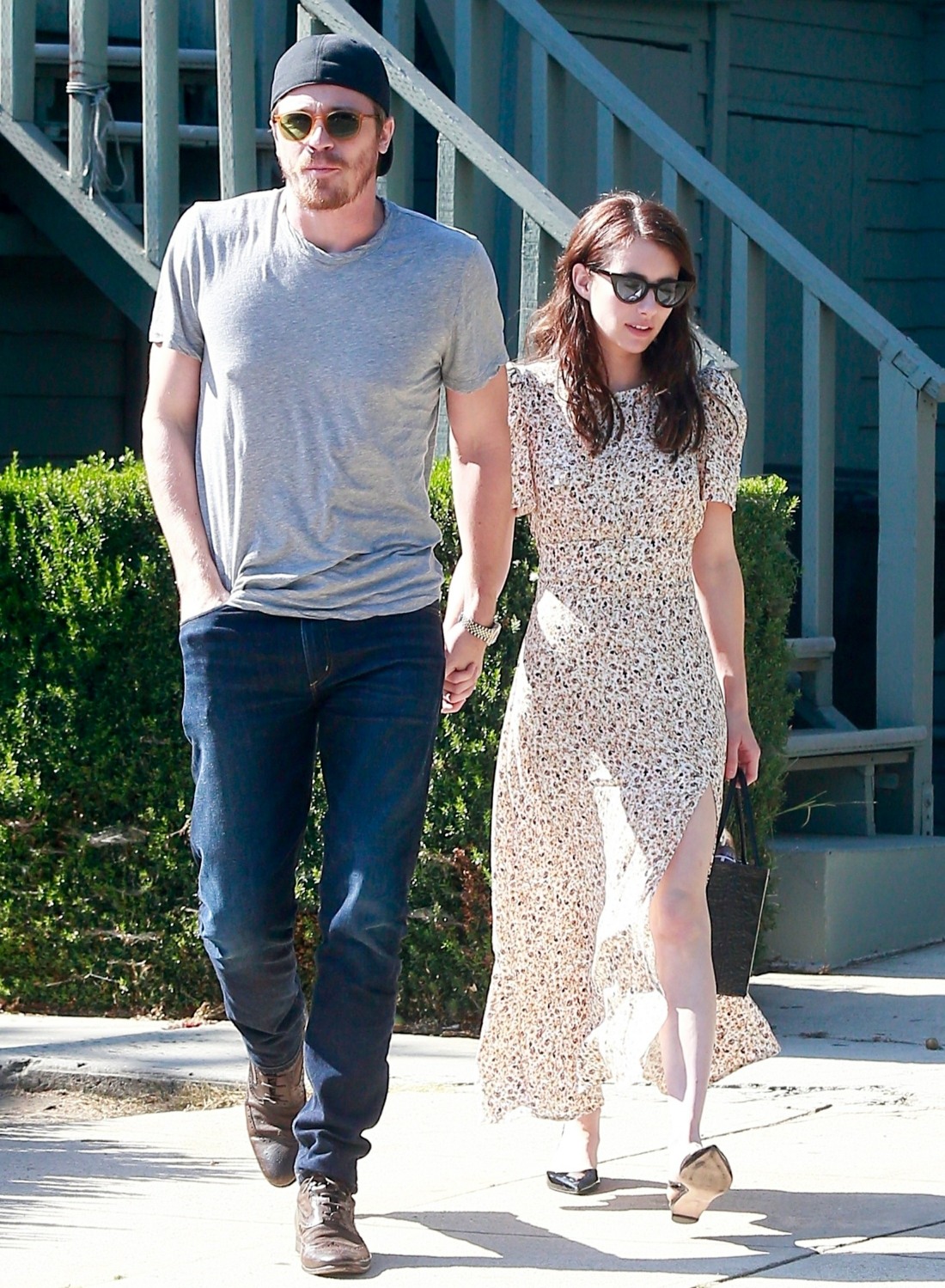 Emma Roberts and Garrett Hedlund hold hands as they head to the movies