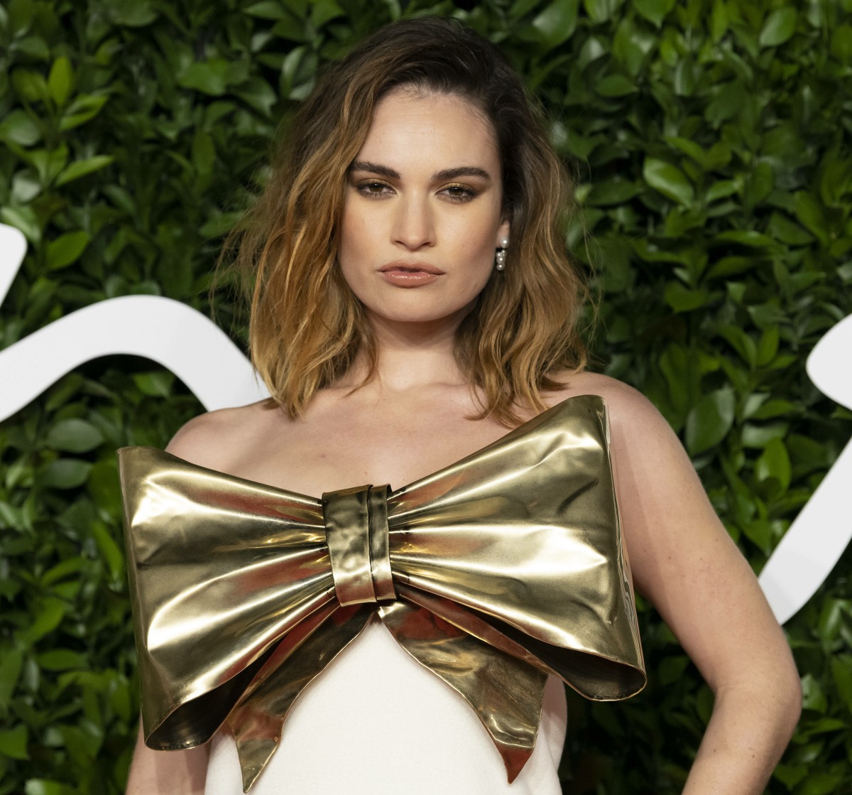 Lily James attends The Fashion Awards 2019 at The Royal Albert Hall. London, UK. 02/12/2019